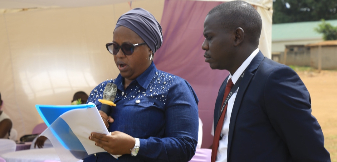 Ms. Aisha Kabira reading Lands minister Hon. Judith Nabakooba's speech
